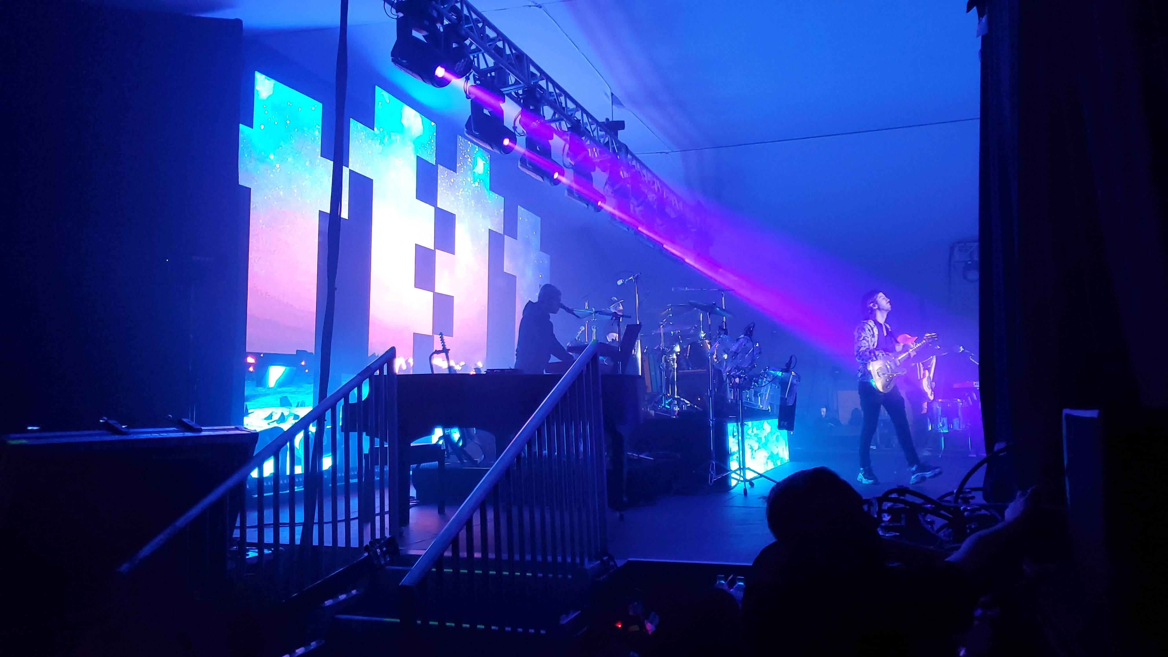 Outdoor band performance under stage lighting