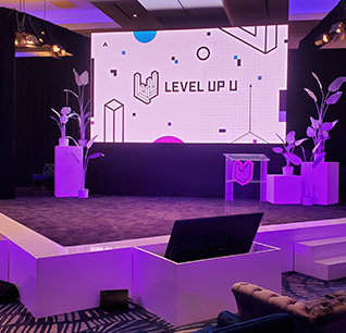 Branded event stage with purple lighting