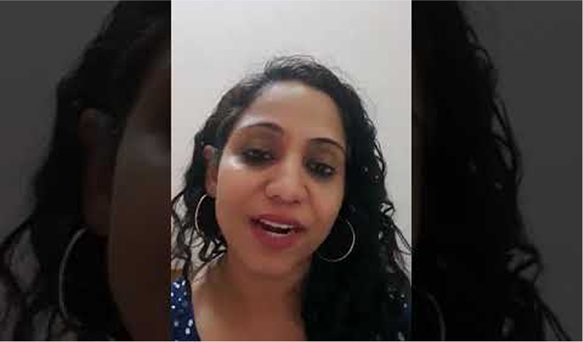 Client testimonial — woman with curly hair