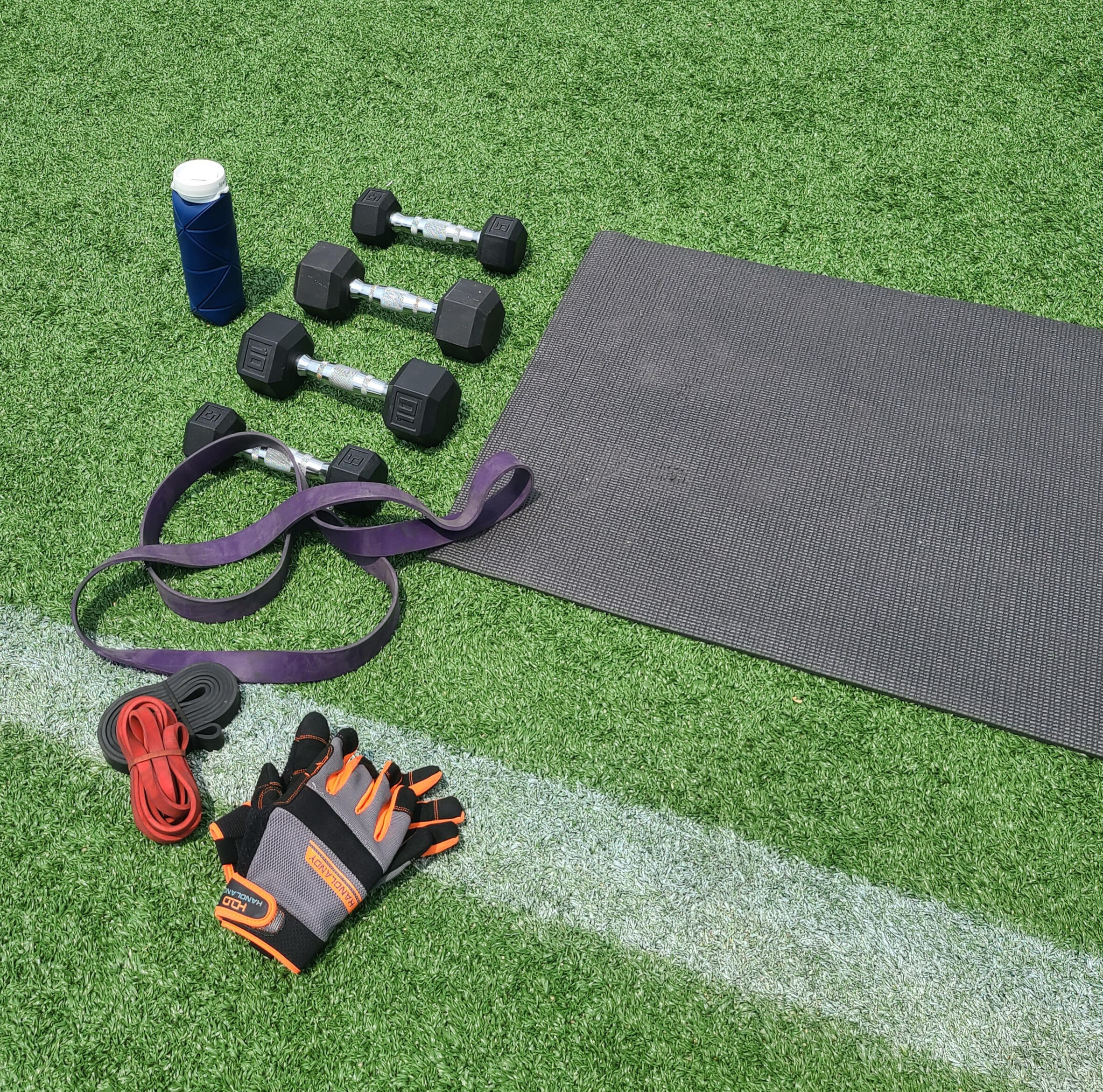 Fitness equipment laid out on turf