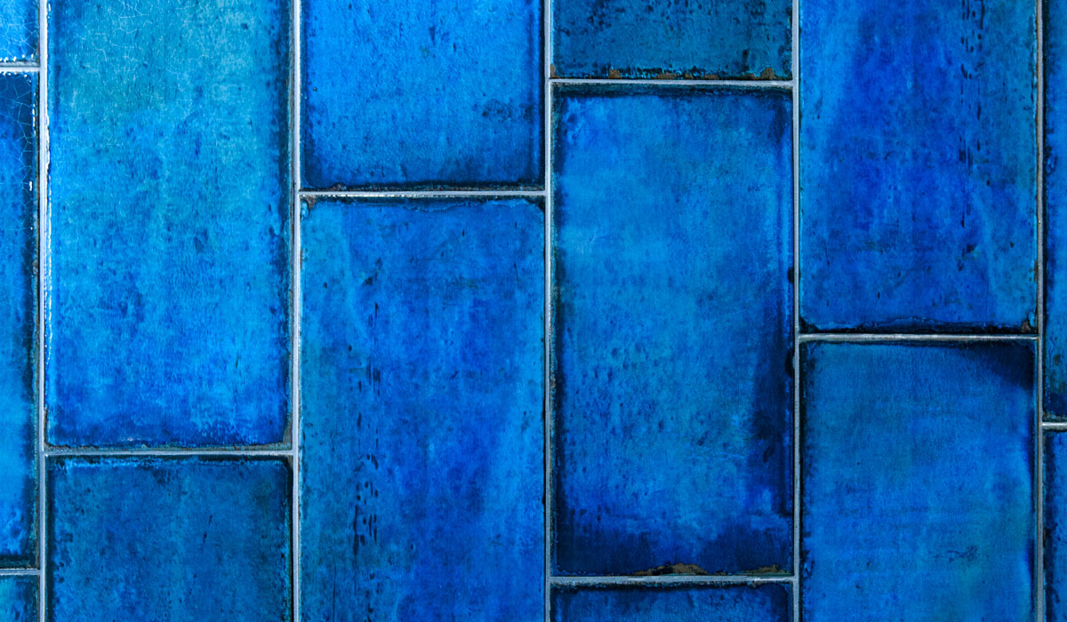 Vivid cobalt-blue glazed wall tiles, a spa interior detail