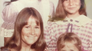 Vintage family photo of a woman with two girls
