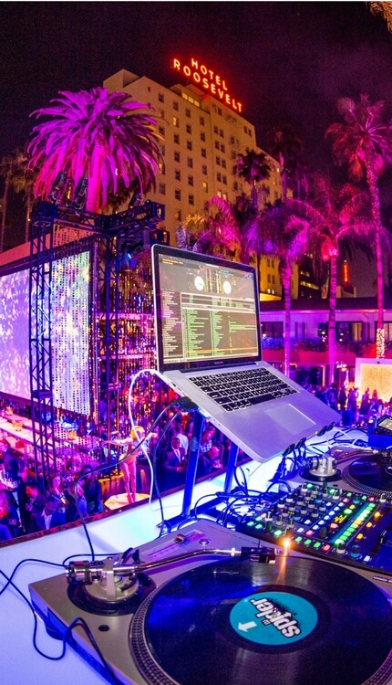 DJ turntable setup at outdoor night festival