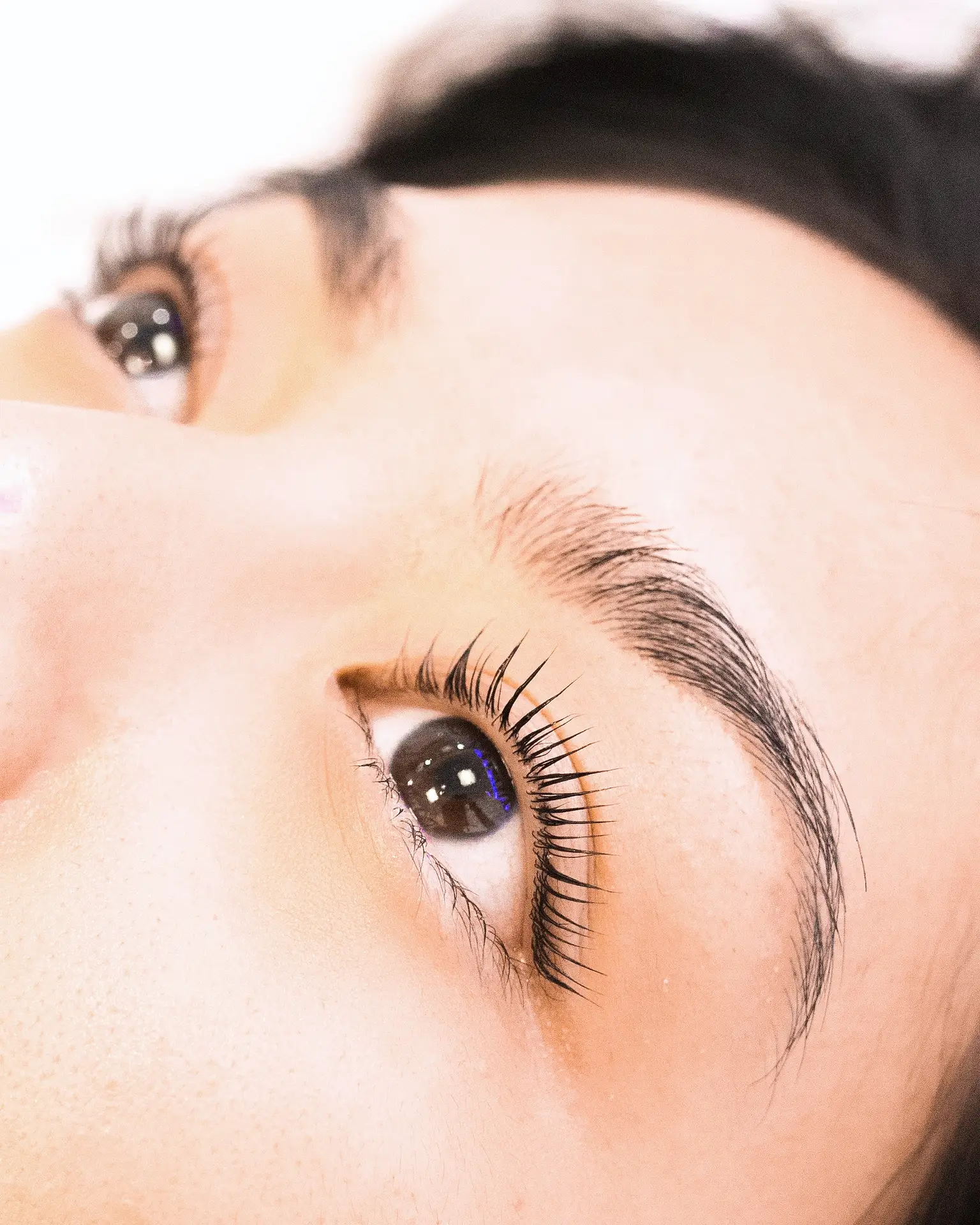 Close-up of an eye showing lash-lift result