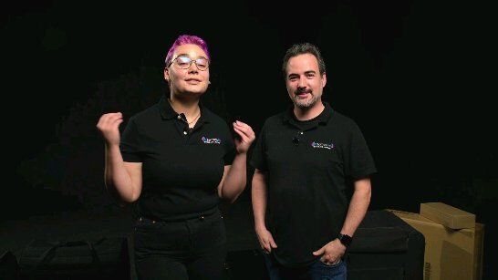 Two Samson team members in branded polo shirts