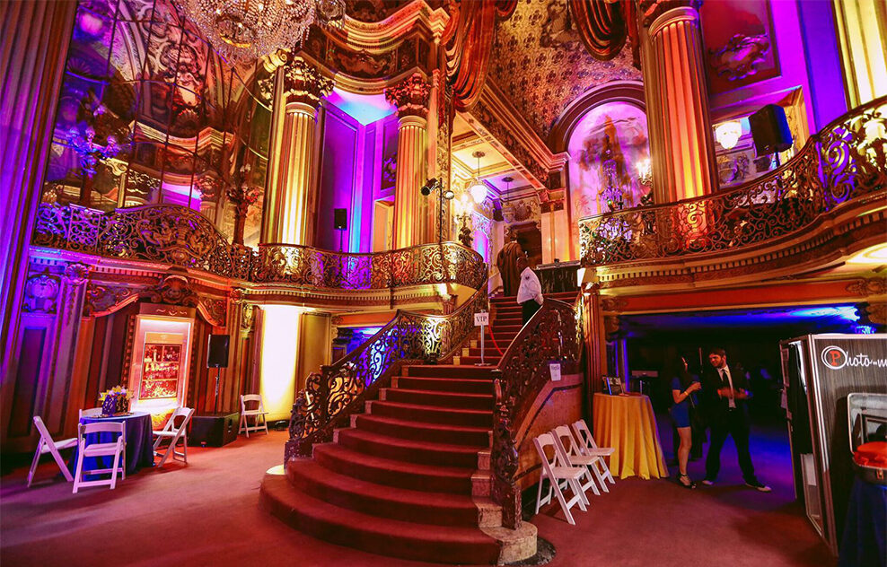 Ornate venue with colorful event lighting
