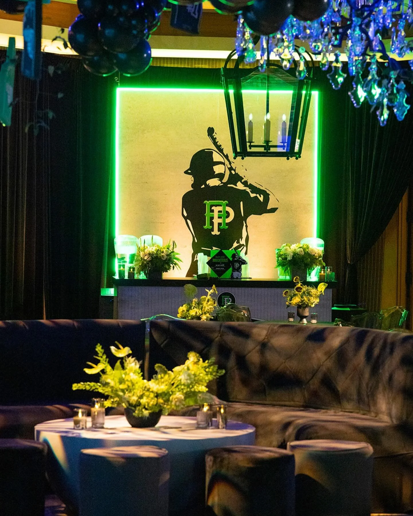 Ballpark lounge — themed seating with yellow florals