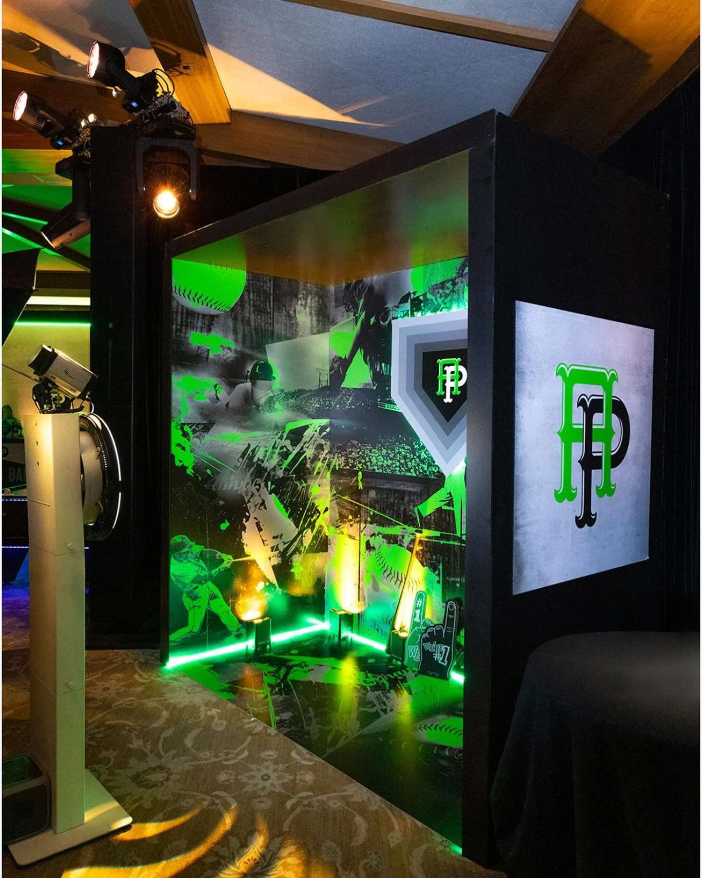 Grand slam photo booth — green baseball graphic backdrop and FP lightbox