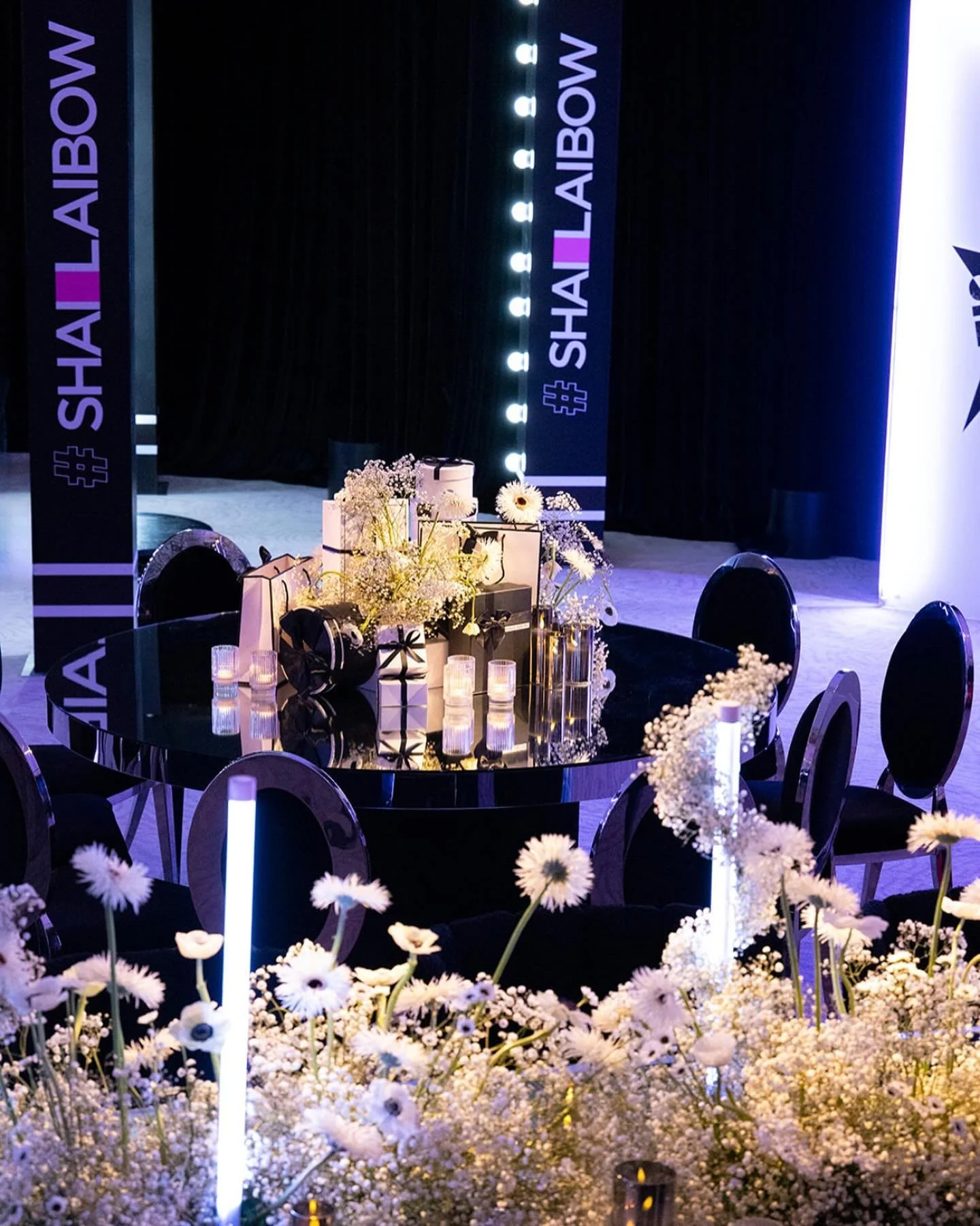 #ShaiLaibow ballroom — banner columns, mirror tables and white florals