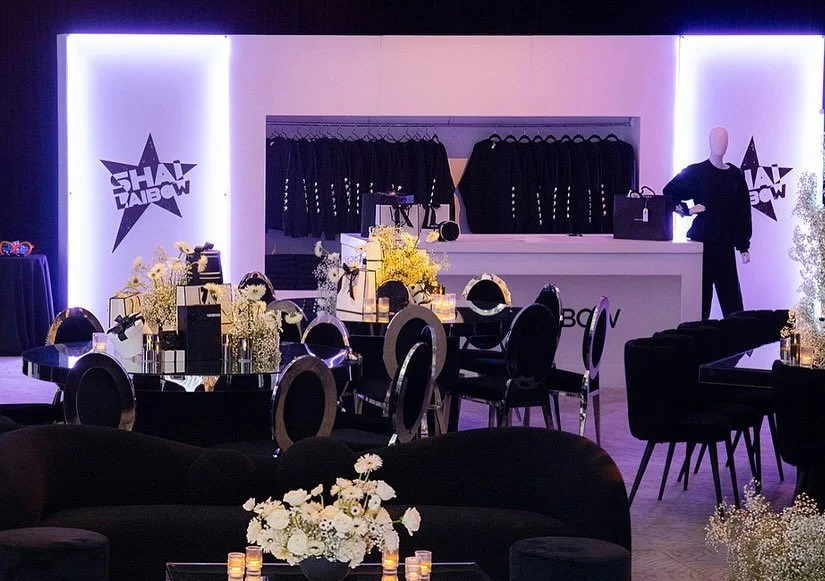 Shai's swag — branded merchandise wall