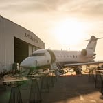 Private jet at a hangar at sunset