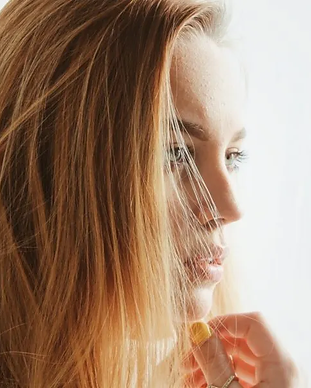 Side profile of a young woman with long hair