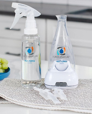 Force of Nature cleaner spray bottle and electrolyzer device on a kitchen counter