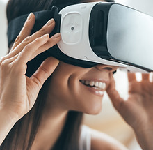 Smiling woman wearing a virtual reality headset