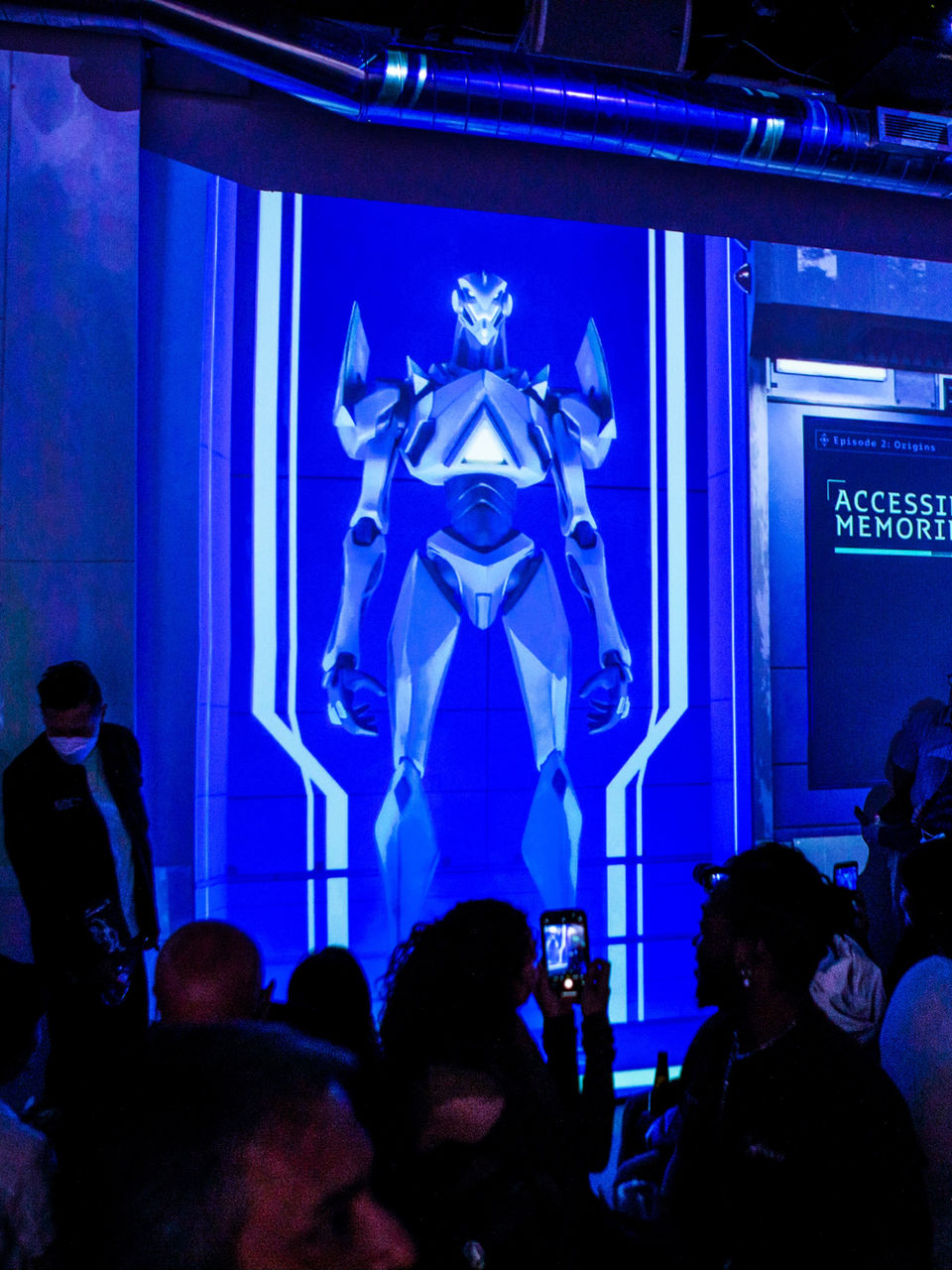 Blue-lit mech installation at the Everai live event
