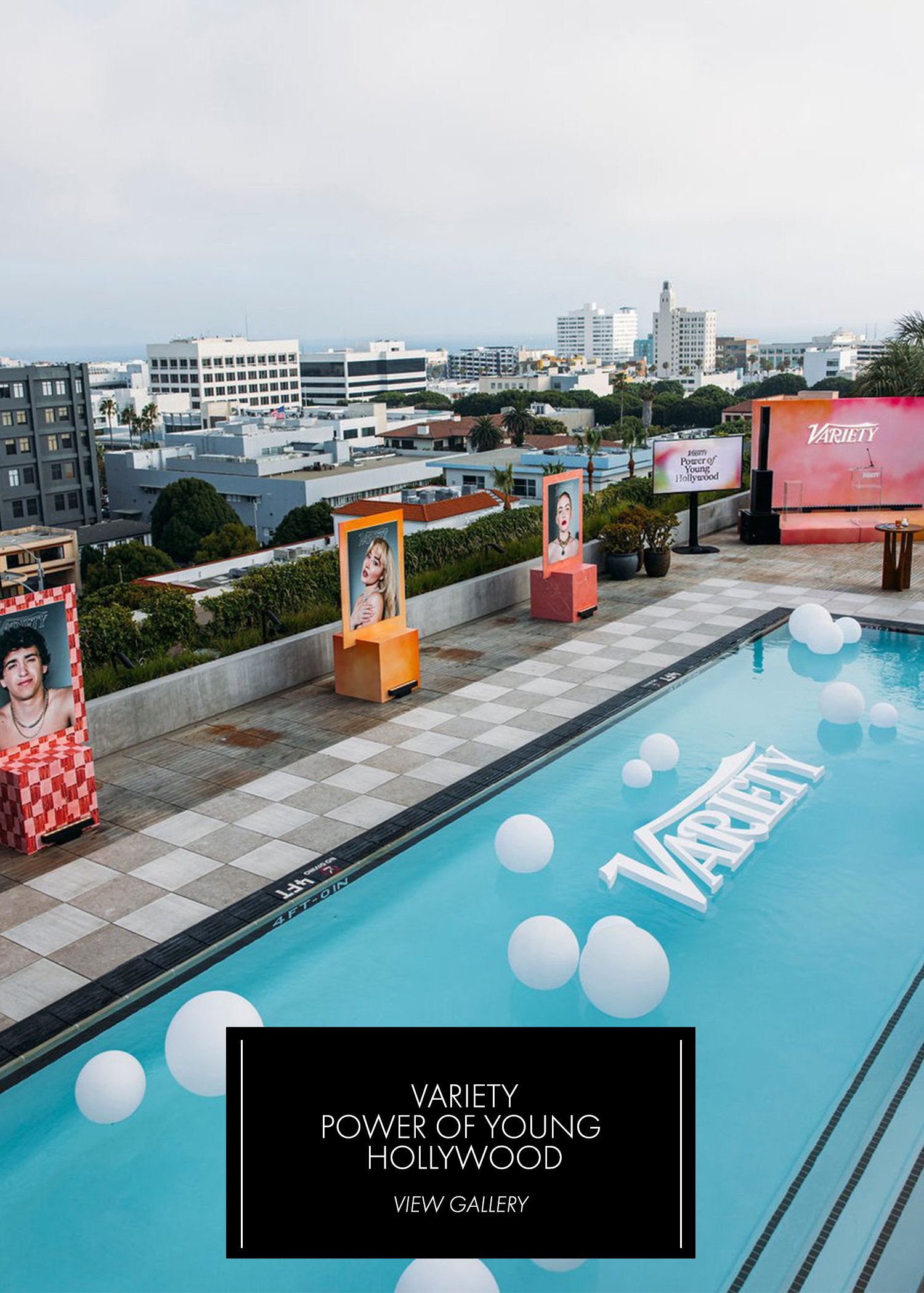 Variety Power of Young Hollywood — rooftop pool event with floating balloons, Variety logo in the pool and city skyline