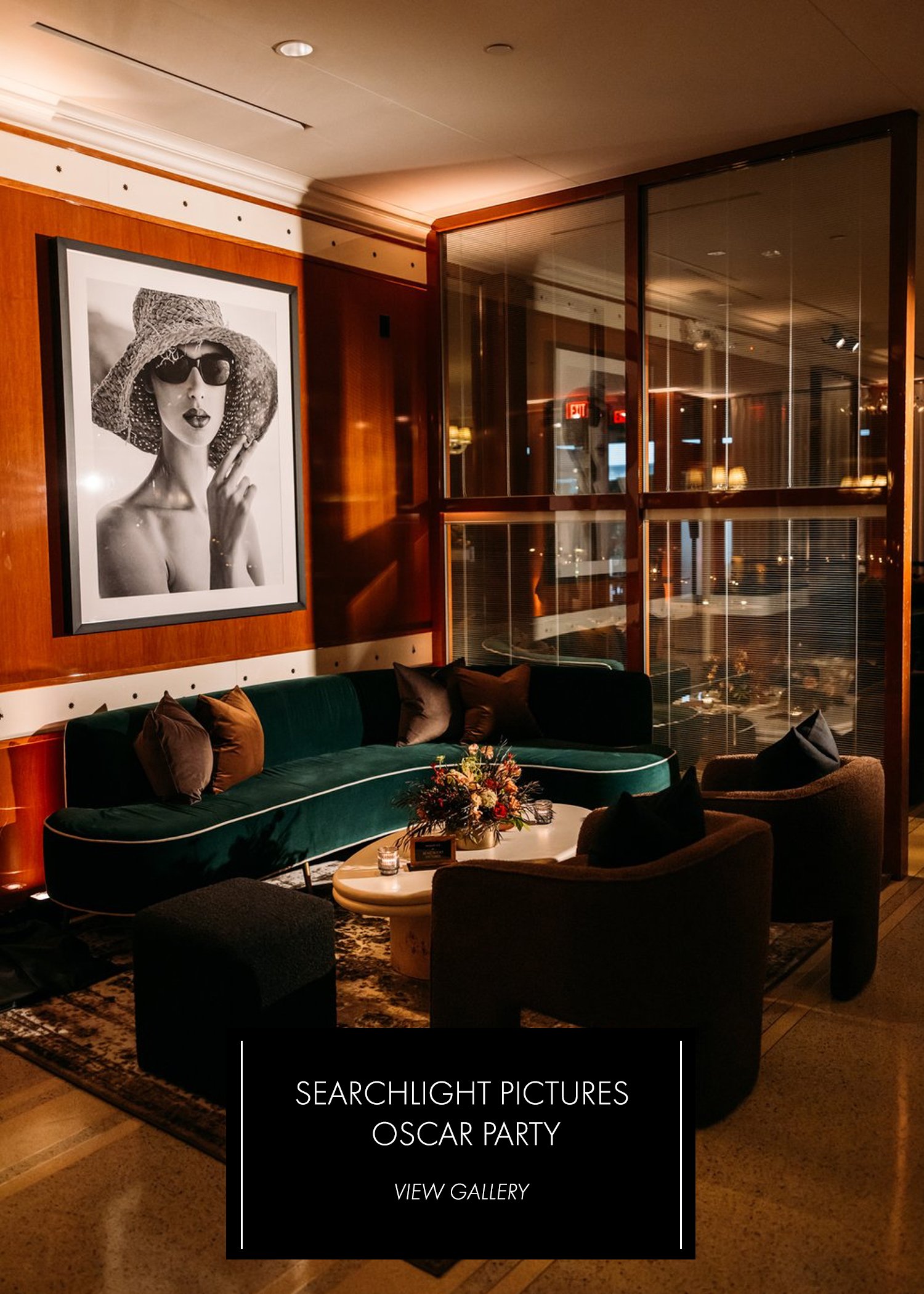 Searchlight Pictures Oscar Party — warm lounge interior with teal velvet sofa and black-and-white art print