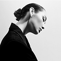 Portrait of Wendy Paige Sterling, hair up in a black jacket