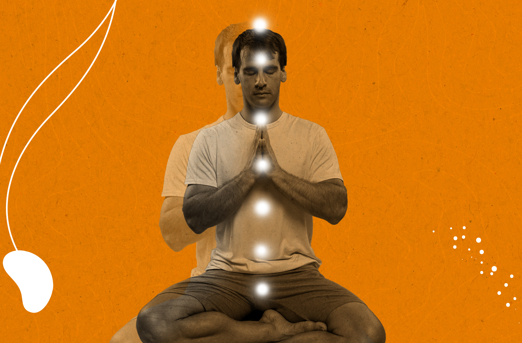 A man meditating cross-legged with glowing energy centers